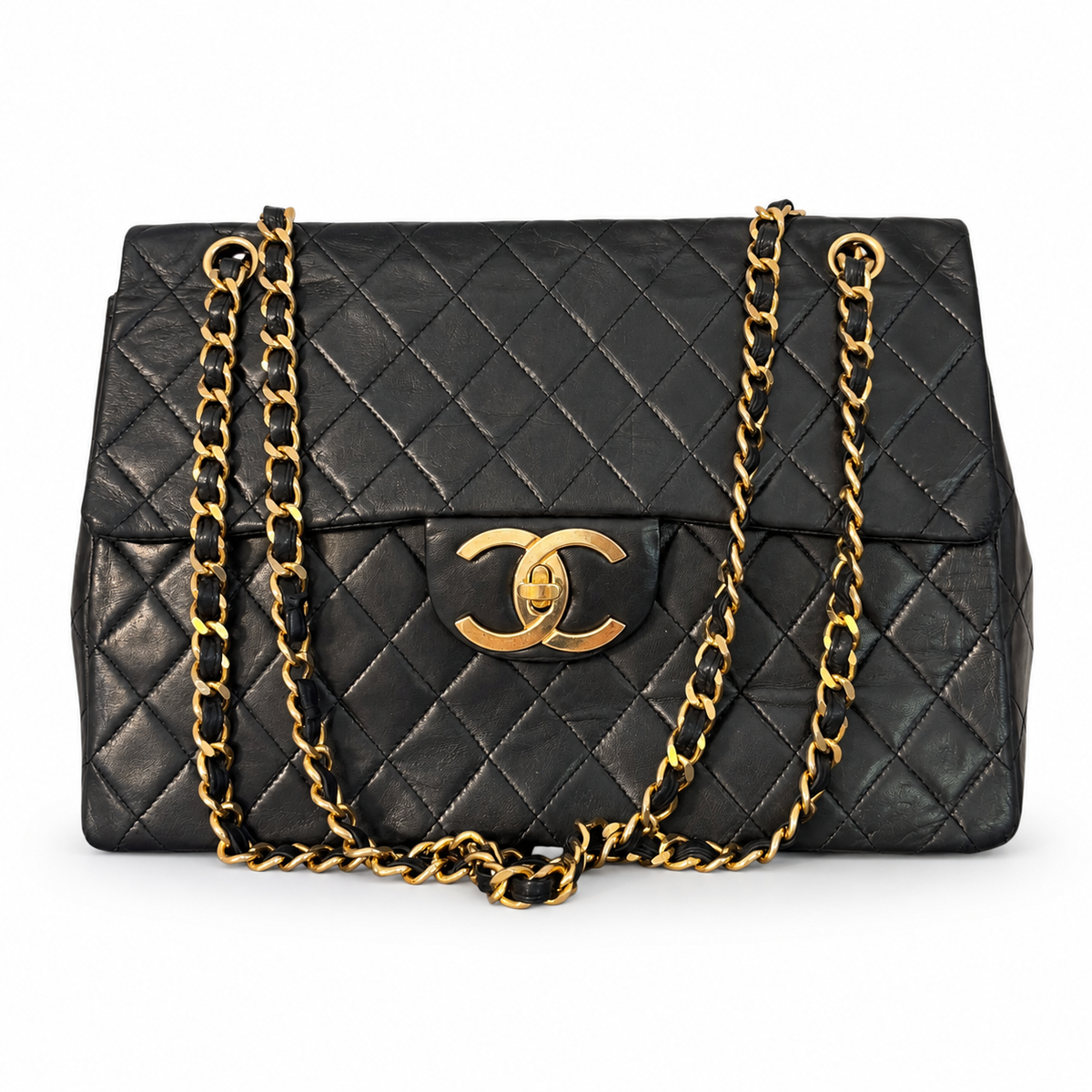 Sac Chanel Maxi Jumbo / Jumbo XL, vintage en cuir noir matelassé – Bijouterie dorée