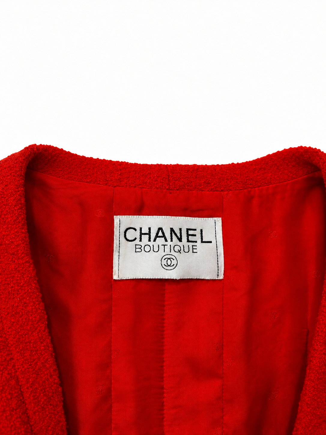 Veste Chanel vintage rouge en tweed bouclé à boutons dorés