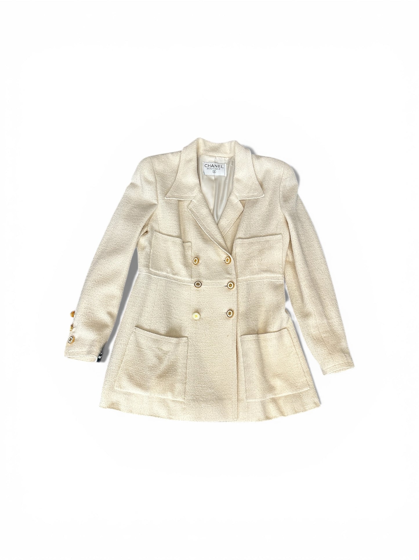 Veste Chanel Boutique en laine écrue – Boutons bijou CC