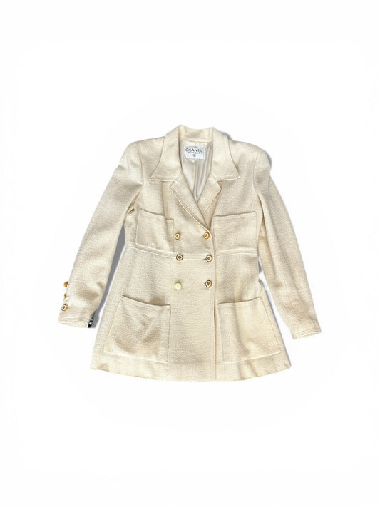 Veste Chanel Boutique en laine écrue – Boutons bijou CC