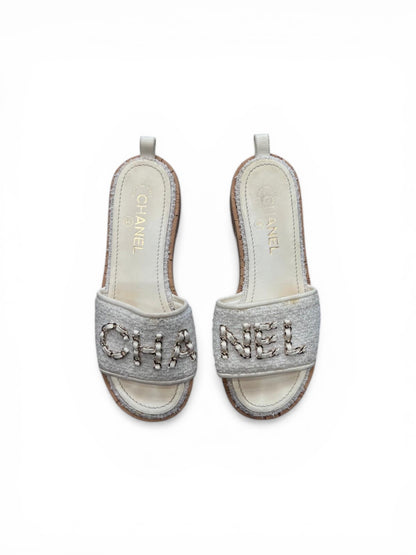 Chanel mules in white tweed
